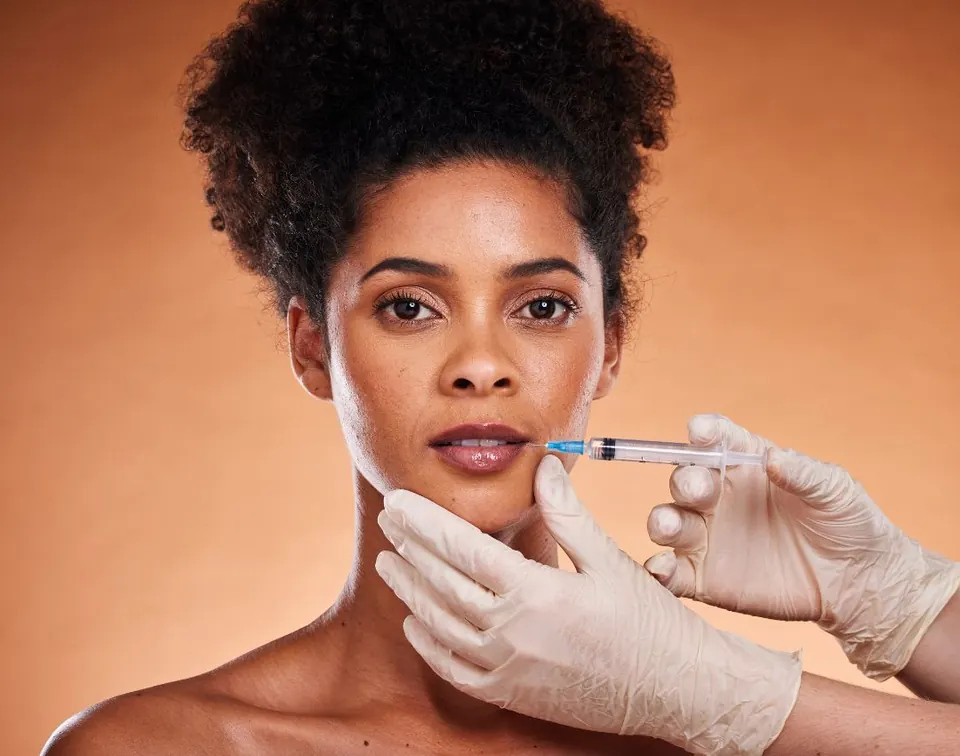 A patient receiving a dermal filler injection