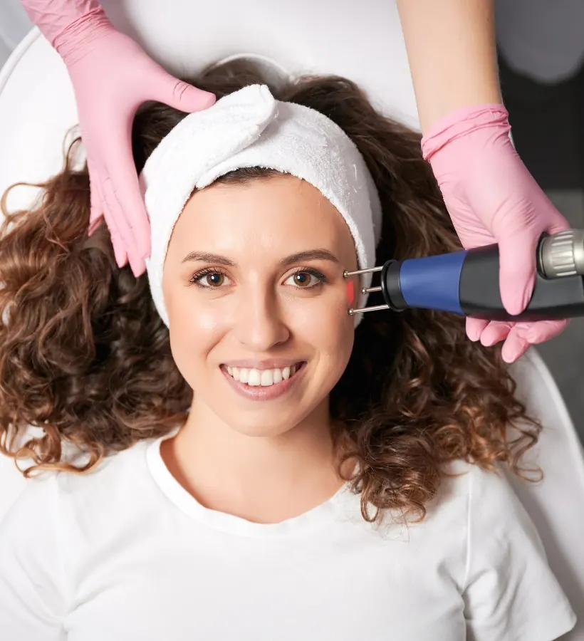 A patient receiving a radiofrequency microneedling skin treatment