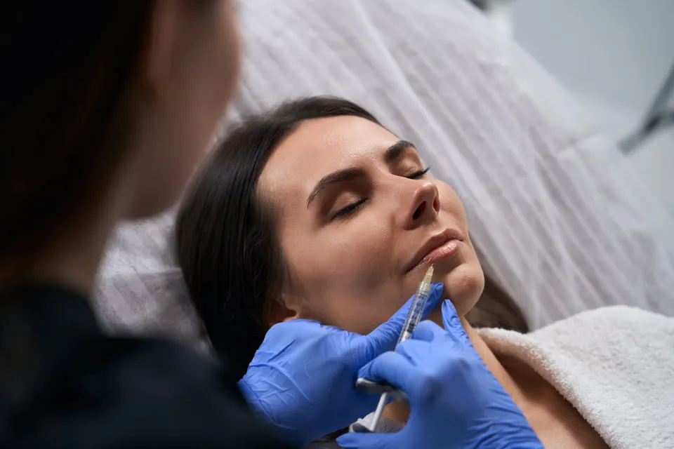 Provider performing dermal filler injections